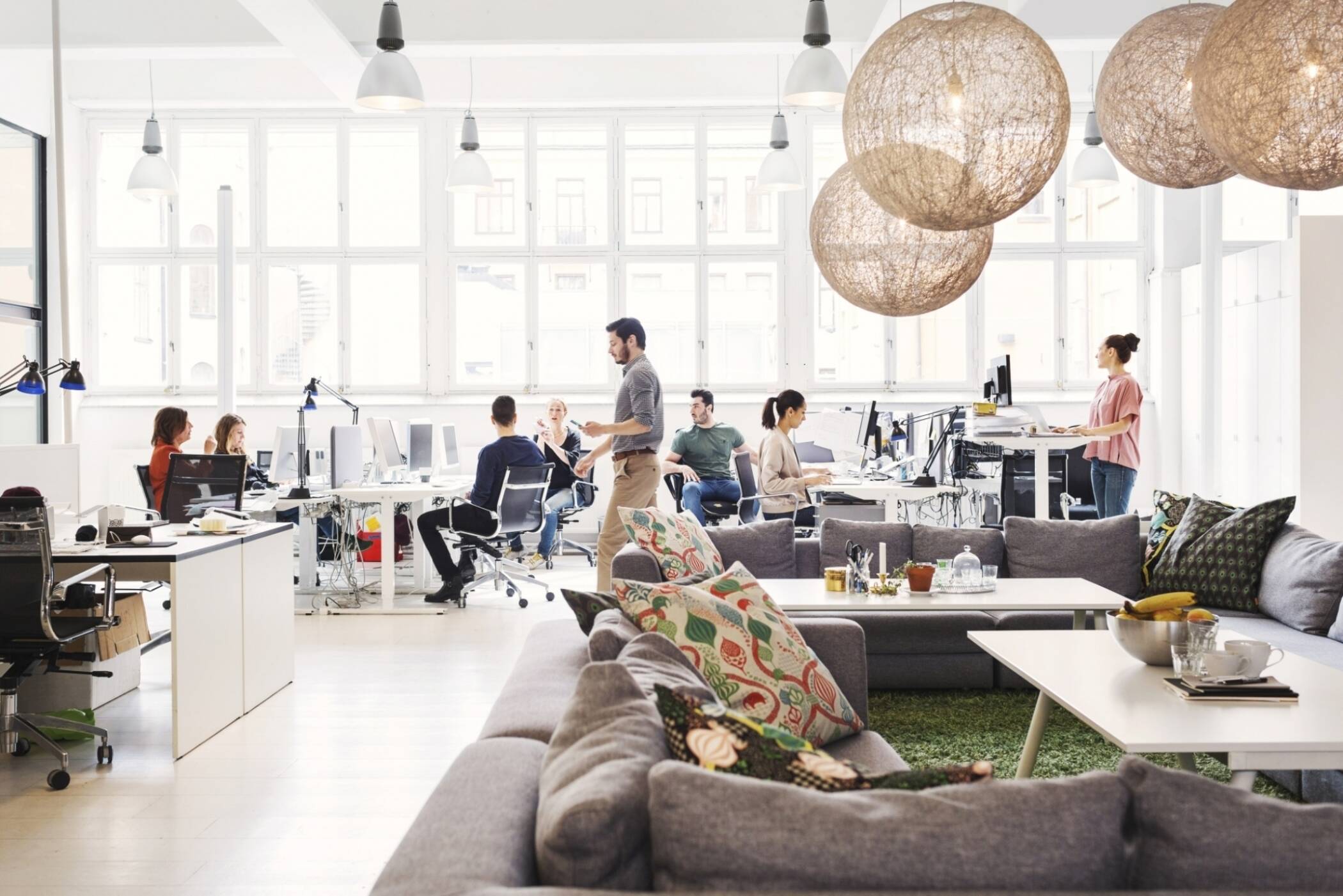 bright modern office with people at desks